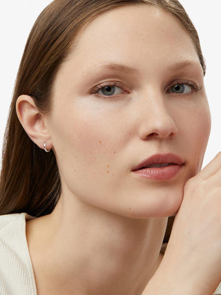 White Huggie Gold Hoop Earrings