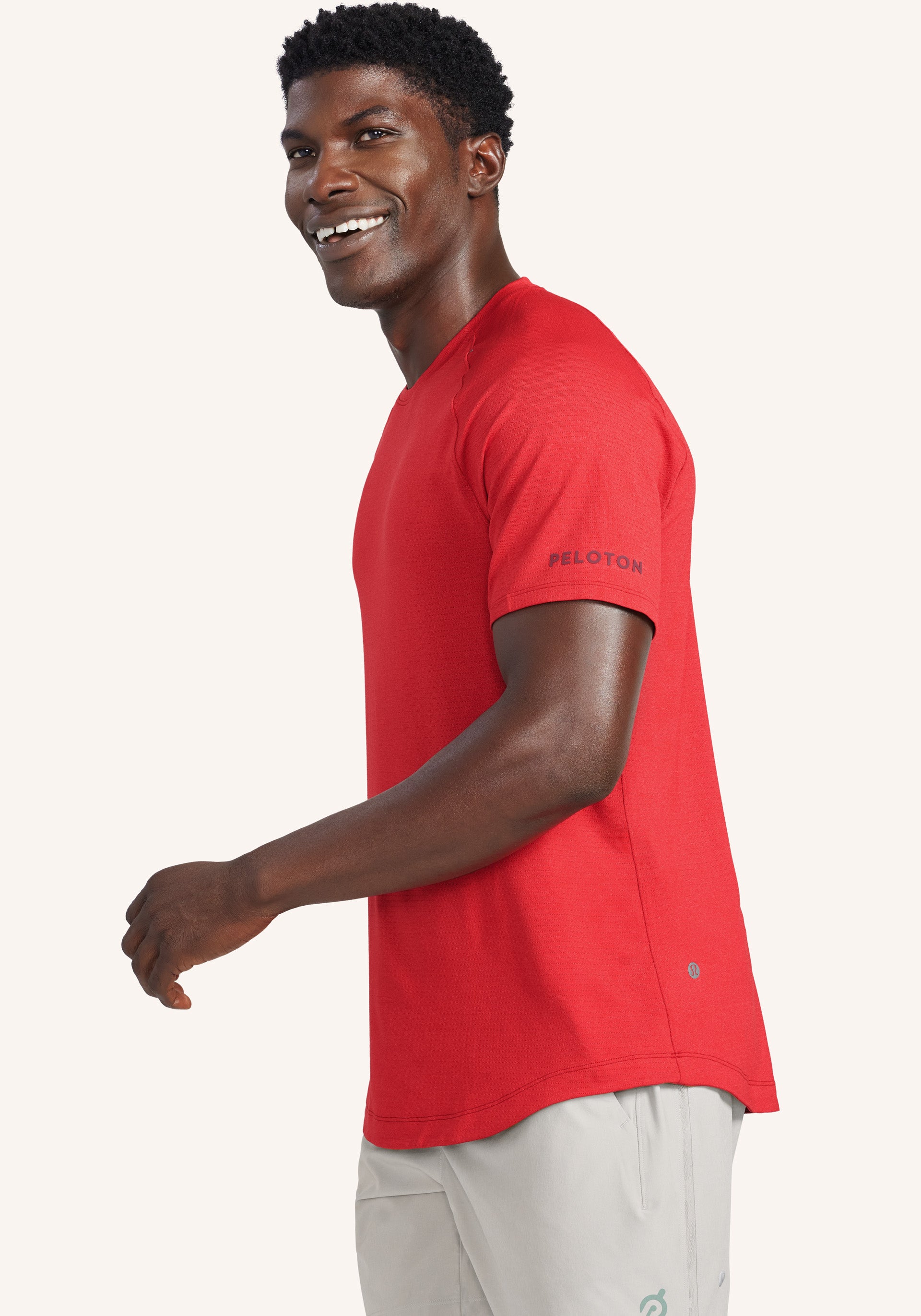 https://apparel.onepeloton.com/cdn/shop/files/LicensetoTrainShortSleeve-RED-size-XS-size-S-size-M-size-L-size-XL-size-XXL-3-Side.jpg?v=1696438258